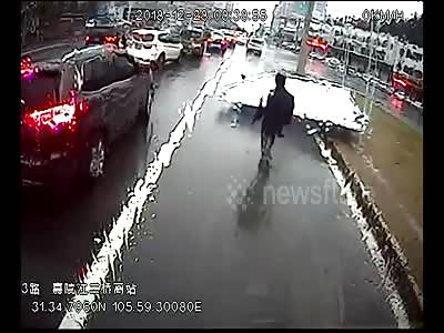 Billboard collapses, crushes motorcyclist beneath it in China