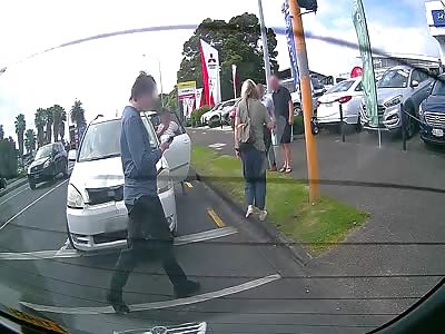 Woman Falls from Car After Minor Accident