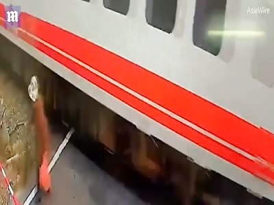 Woman puts her life at risk as she nearly gets hit by oncoming train