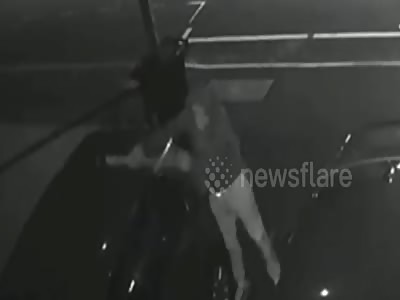 Dramatic CCTV shows yob swings pickaxe through roof of family car