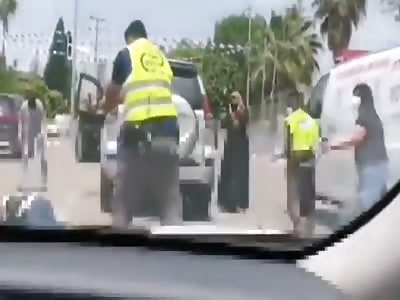 An unknown man attacked the guard with a knife and was shot.