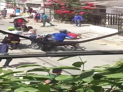 Thief beaten in the street by mob.