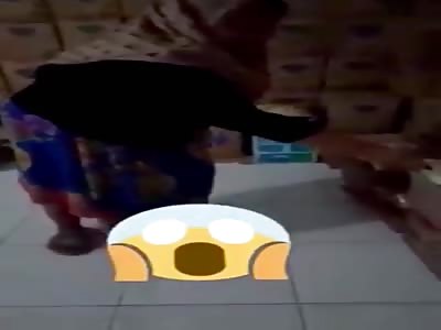 Female Thief  Caught Stuffing Groceries Under Her  Long Skirt 