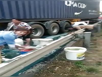 People are stealing diesel at a transporter accident site