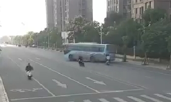 Biker Collides w/ Turning Bus