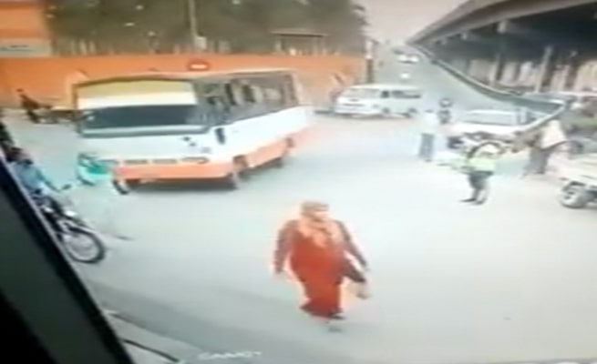 Woman Walking Taken Out by Bus
