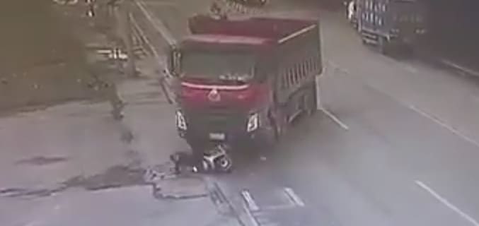 Biker Flattened by Dump Truck