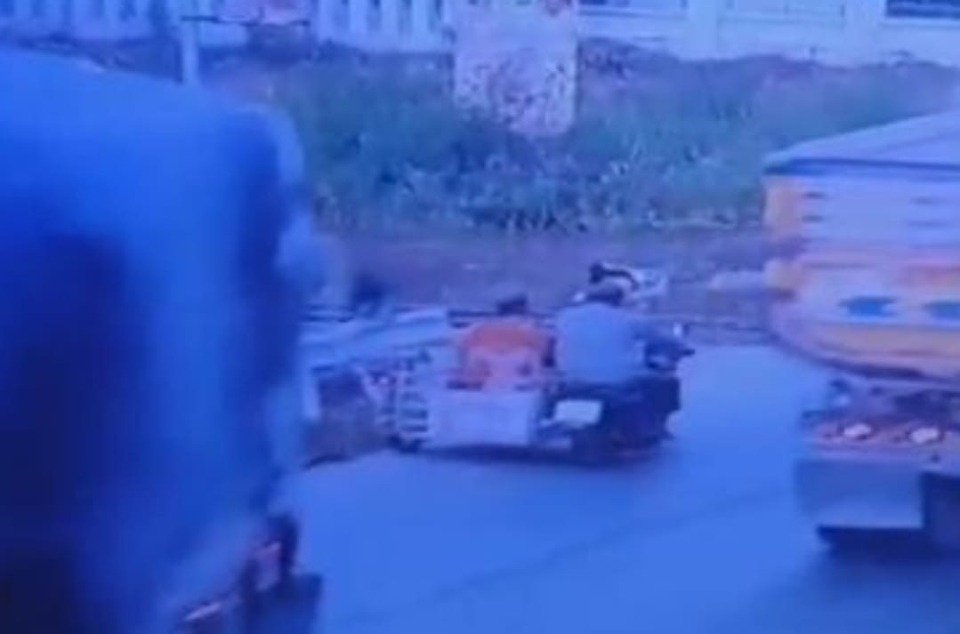 Semi Topples Onto Two in Sidecar