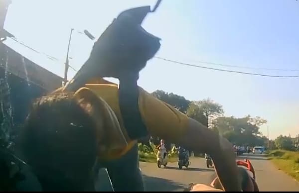 Motorbiker Meets the Hood of a Car