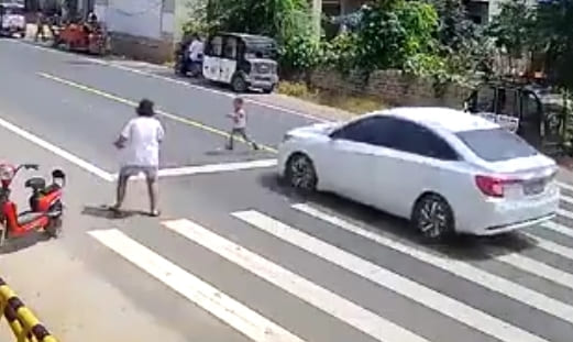 Kid Sent Sliding Across the Pavement 