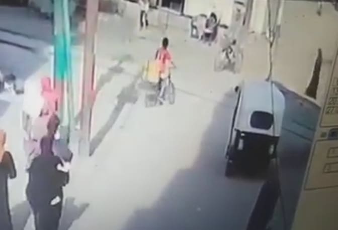 Oblivious Kid on Bike Hit by Train