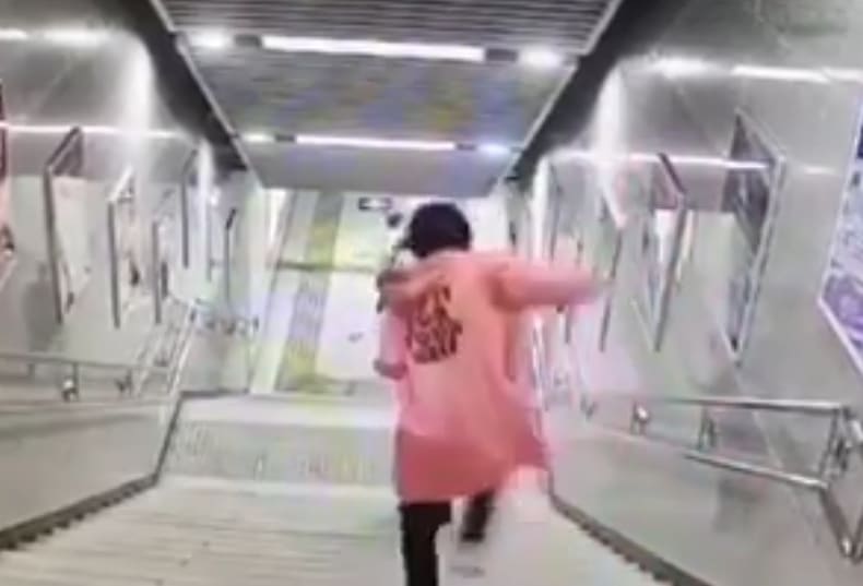 Woman Preoccupied with Phone Takes a Nice Tumble 