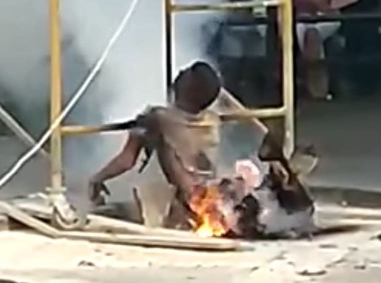 Worker Fries and Sizzles On Scaffold