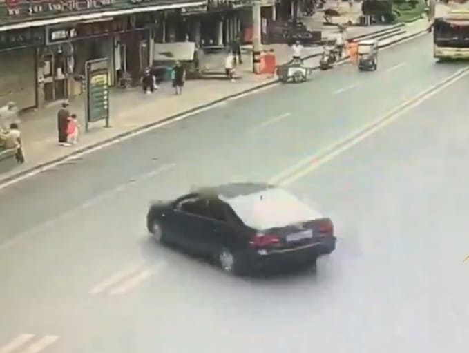 Black Car Causes Havoc On The Sidewalk 