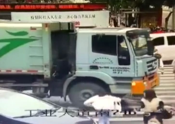 Woman Throws Herself Under Truck Wheels 