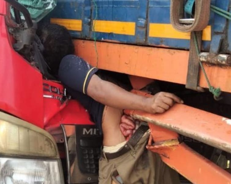 Man Changing Tire Crushed Between Two Trucks