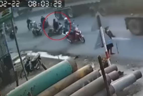 Moped Lady Meets Truck Wheels