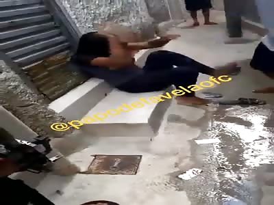 girl being punished by bandits in the favela