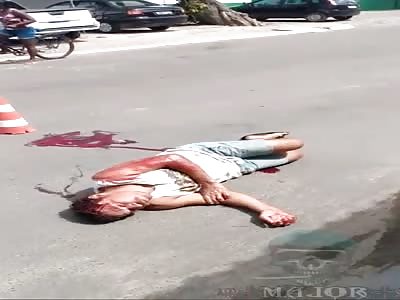 man agonizing on the street waiting for help