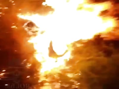 body of a murdered man being burned