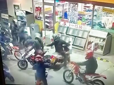 Youths on scooters invade Shell filling station