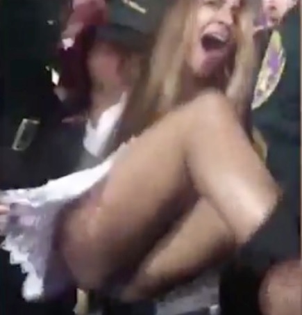 Crazy Girl Attacks People at Football Game gets Beaten by Police