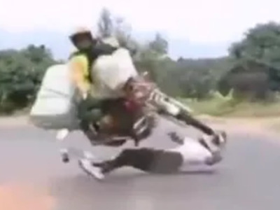 Skater hits Full Size Motorcycle (Watch Slow Motion)