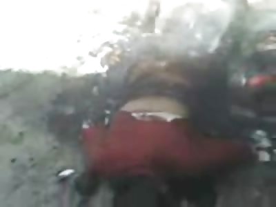 Murdered Burning Woman Lies Face Down Half still Smoking and On Fire..