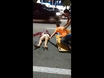 Poor Man Cries next to His Deceased Wife in the Street 