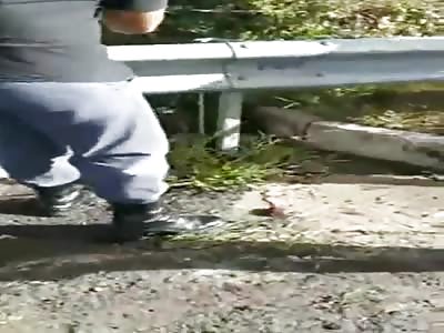 Motorcyclist in Bright Blue Socks is Literally Wrapped Around a Guard Rail