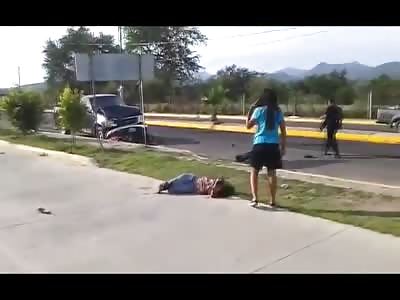 Woman with Leg Broken Lies in Agony on the Pavement 