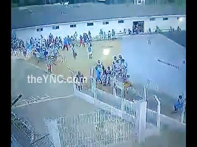 Inmate Casually Strolls Around Prison Yard with a Prize .... The Head of His Enemy 