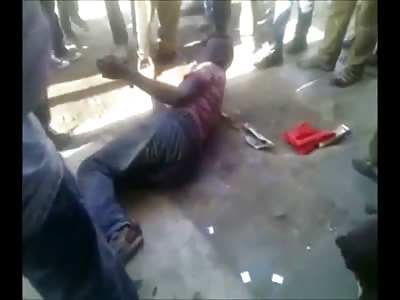 Man Gets Beaten with Rocks, Kicks Then Gets Pissed on..... Fight Stops When he Gets a Phone Call