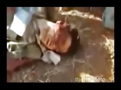 Wounded Agonizing Man is Beheaded with a Butcher Knife