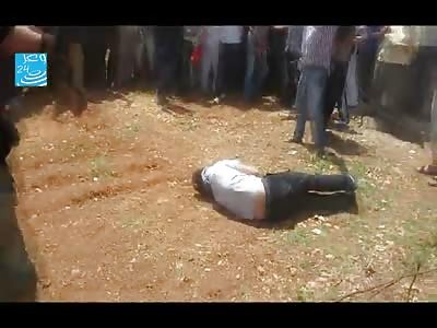 NEW: Crowd Watches Man Get Executed with a Pistol Shot.....Then They Start Mutilating the Corpse