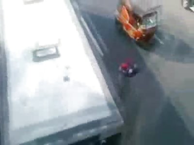 Confusing Video shows a Student in the Street Run over and Killed by a Bus