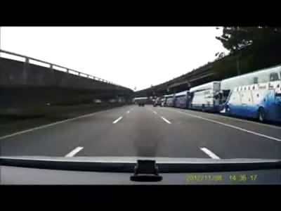 Moped Crushed under Big Yellow Truck When he Idiotically Swerves in front of it