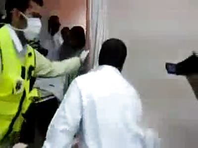 Fighting to Keep The Guy Alive Who's Brains are Flapping in the Wind