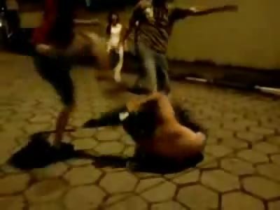 Guy is Badly Beaten with Motorcycle Helmets by Two Guy