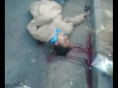 Moaning Man lay Dying next to his Woman in the Road 