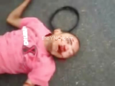 Man in Pink Lies Twisted and Dead from Bike Accident