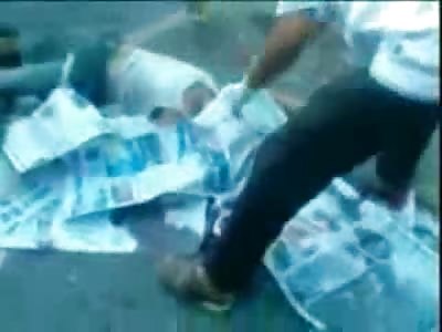 Man Scalped is taken off the Road as Onlookers get some Pictures with their Cell Phones