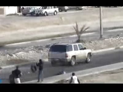 Pissed of Driver had Enough of the Youth Setting Fire Road Blocks... Runs Right over One of the Kids