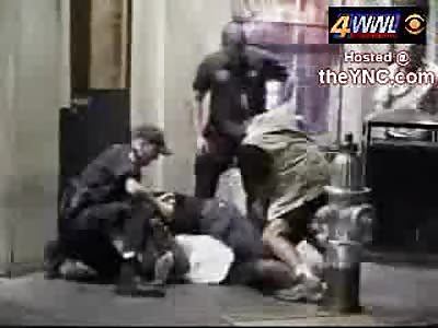 Police beat a suspect outside of a bar.