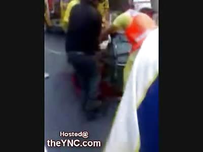 Man loaded on the Gurney with Nothing Left of his Dangling Legs