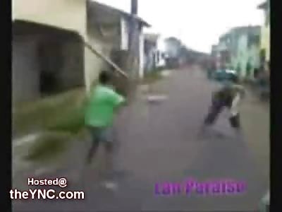 Man is Brutally Beaten by an Entire Crowd  with Clubs in the Street