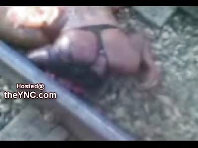 Half Decapitated Female lies only in her Black Bra after Suicide