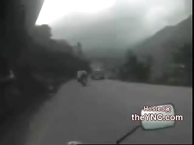 Motorcycle Cam Records Truck Falling into Biker