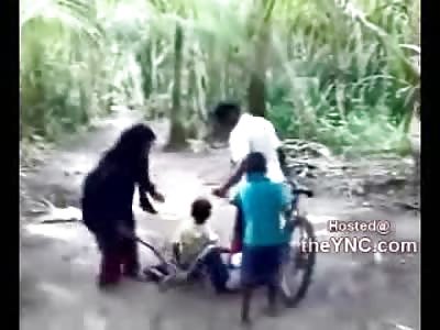 DAMN: Crazy Arab Mom Beats her Kids and has them Tied Together to Boot