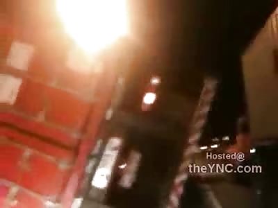 Dead Dude Under a Tractor Trailer on the Street